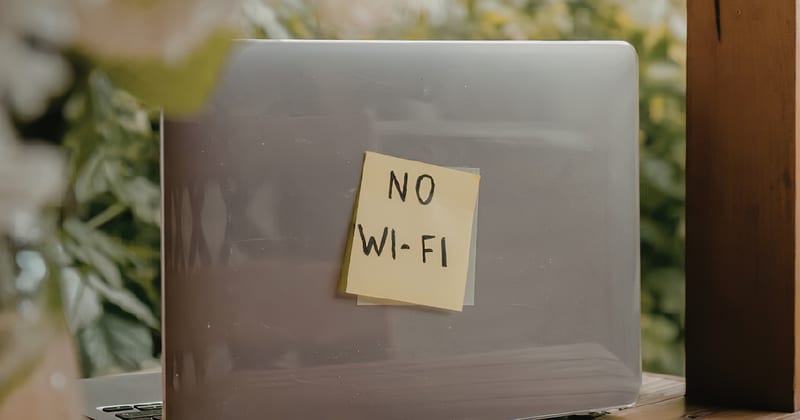 A laptop with a handwritten “No Wi-Fi” note; Meriden’s city network was taken offline after the February cyber incident