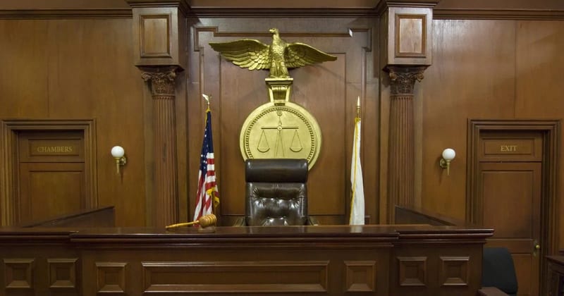 An empty judge's bench in a courtroom