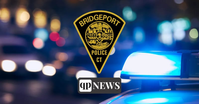 Bridgeport Police Department patch over a police cruiser's blue lights at night