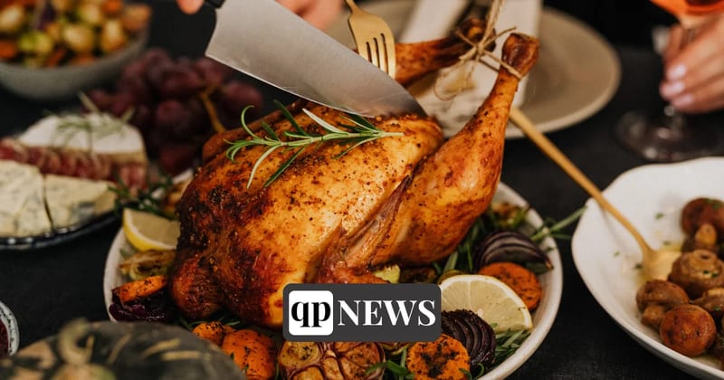 A roast turkey with vegetables on a holiday table